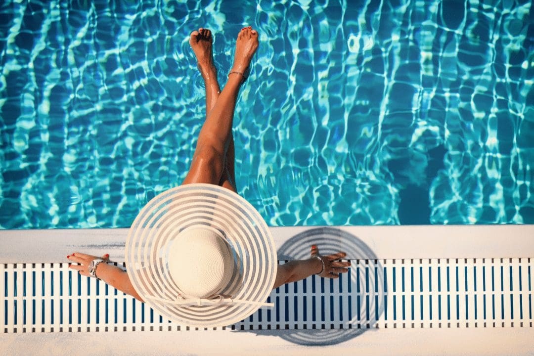 summer vacation. Girl in a swimming pool